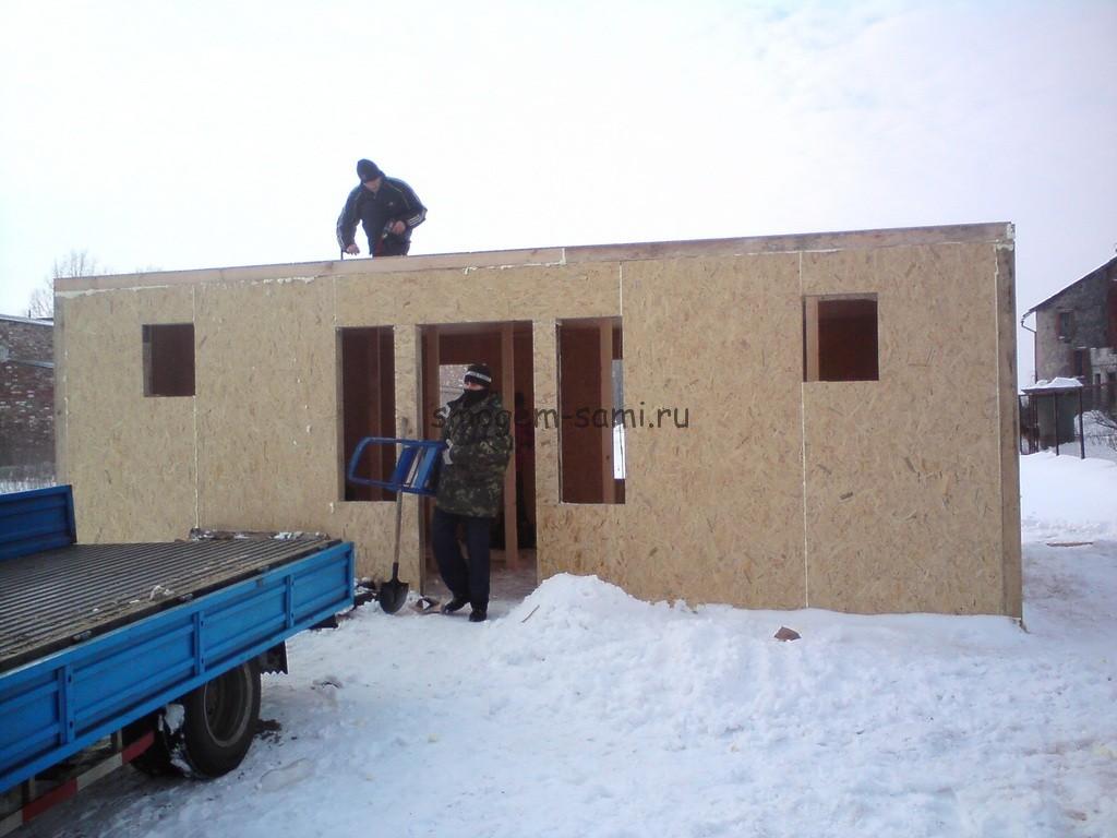 сборка дома с гаражом из структурных домостроительных панелей
